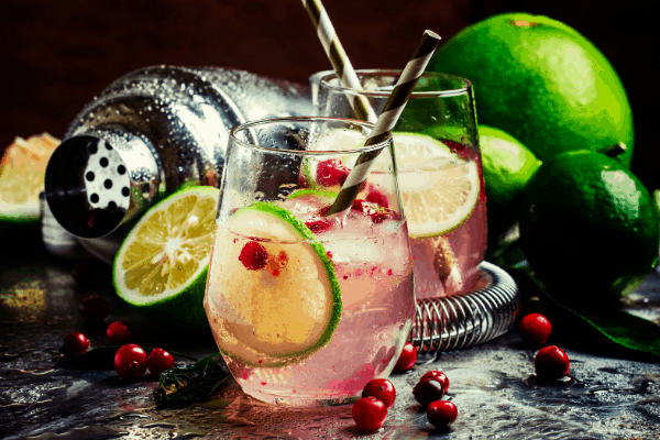 pink gin cocktail with berries and lime
